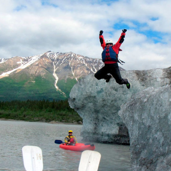 Guest jumping off iceberg in Alaska - Explore McCarthy