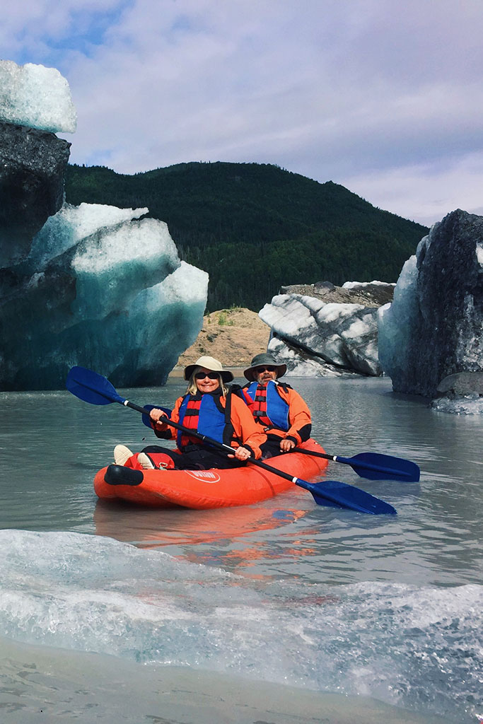 Kayakers kayaking next to glaciers - Explore McCarthy