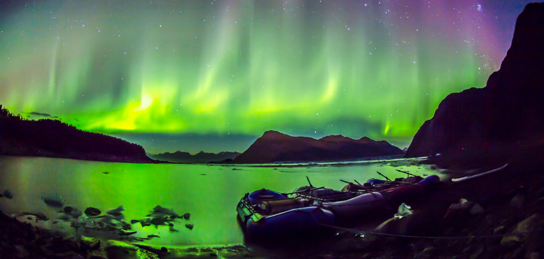 Explore McCarthy - Northern Lights with raft boats in view